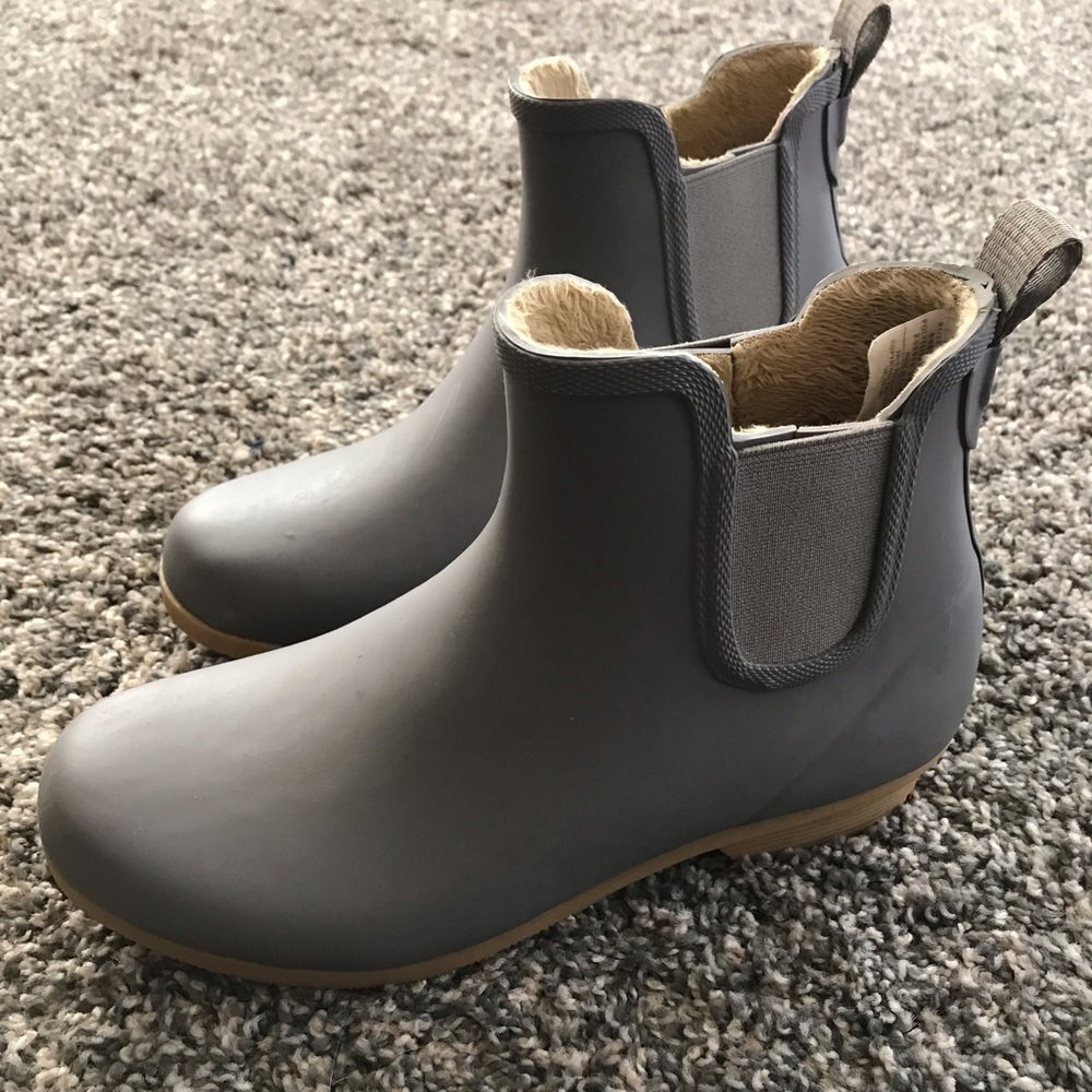 Ankle fur lined rain boots. Never been worn